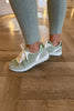 PALE GREEN AND WHITE FAUX SUEDE TRAINERS
