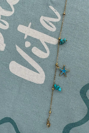 GOLD BRACELET WITH BLUE SEA CHARMS
